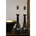 A pair of ceramic and composition table lamps, formed as columns, on square stepped bases, 15 1/2"