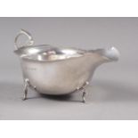 A silver sauce boat, on trefoil feet, 2.8oz troy approx