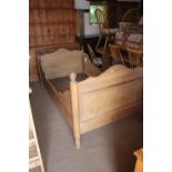 A 19th century stripped pine bed with shaped panel ends, 42" wide overall x 72" long