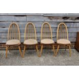A set of four Ercol 365 Quaker Windsor chairs, on turned and stretchered supports