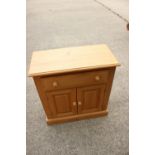 Three waxed pine side cabinets, fitted drawers over cupboards, 27 1/2" wide x 13" deep x 29" high