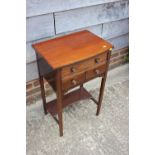 An Edwardian mahogany and banded bowfront work table, fitted two drawers and undertier, 17 3/4" wide