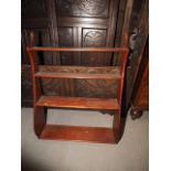 An early 19th century mahogany four-tier waterfall bookcase, 25" wide x 7 1/2" deep x 32" high