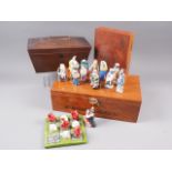 A mahogany sarcophagus two-division tea caddy, 10 1/2" wide, a mahogany desk tidy with pierced back,