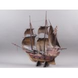 A carved wood model of a 16th century galleon in full sale, 27" long x 28" high