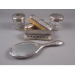 A silver mounted toilet and brush set with animal skin effect decoration