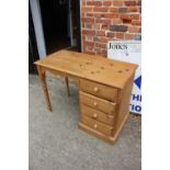 A stripped pine single pedestal desk, fitted four drawers, 42" wide x 20" deep x 29 1/2" high