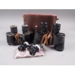 A pair of military 6x30 binoculars, in travelling case, another pair of binoculars and a pair of