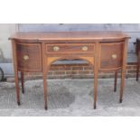 A Sheraton Revival mahogany and satinwood banded break bowfront sideboard, fitted cupboard drawer