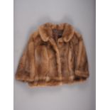 A mink fur jacket and a similar fur stole