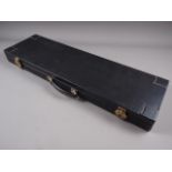 A black leather rectangular gun case with fitted green baize interior, 31 1/2" long overall x 10"