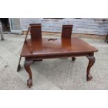A late 19th century mahogany extending dining table with three extra leaves and winder, on