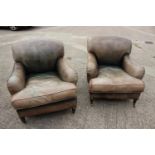 A pair of George Smith deep seat armchairs with loose seat cushions, upholstered in a green leather,