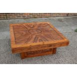 An African? carved hardwood square shaped coffee table, on block base, 42" square