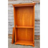 A yew closed back bookcase with one fixed shelf and four loose shelves, 40" wide x 74" high