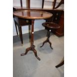 A mahogany cherrywood circular top occasional table, on turned column and tripod splay supports, 18"