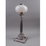 A silver plated and cut glass oil lamp with fluted column and swag decoration to base, 17 1/2" high