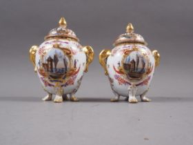 A pair of 19th continental porcelain century two-handled jars and covers, decorated panels with