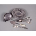 A white metal punch ladle (no handle), four assorted spoons, a white metal bonbon dish and a heart-