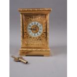 An early 20th century Strydhagen style five-window and gilt metal hour striking carriage clock