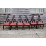 A set of six Chinese hardwood "Imperial Ming" carver chairs with carved dragon splay and panel seats