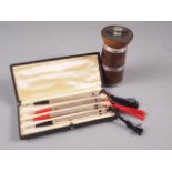 A set of four white metal bridge pencils, stamped sterling silver, in box, and a turned hardwood and
