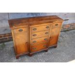 A yew wood break front sideboard, fitted six drawers and two cupboards, 41" wide, and a mahogany