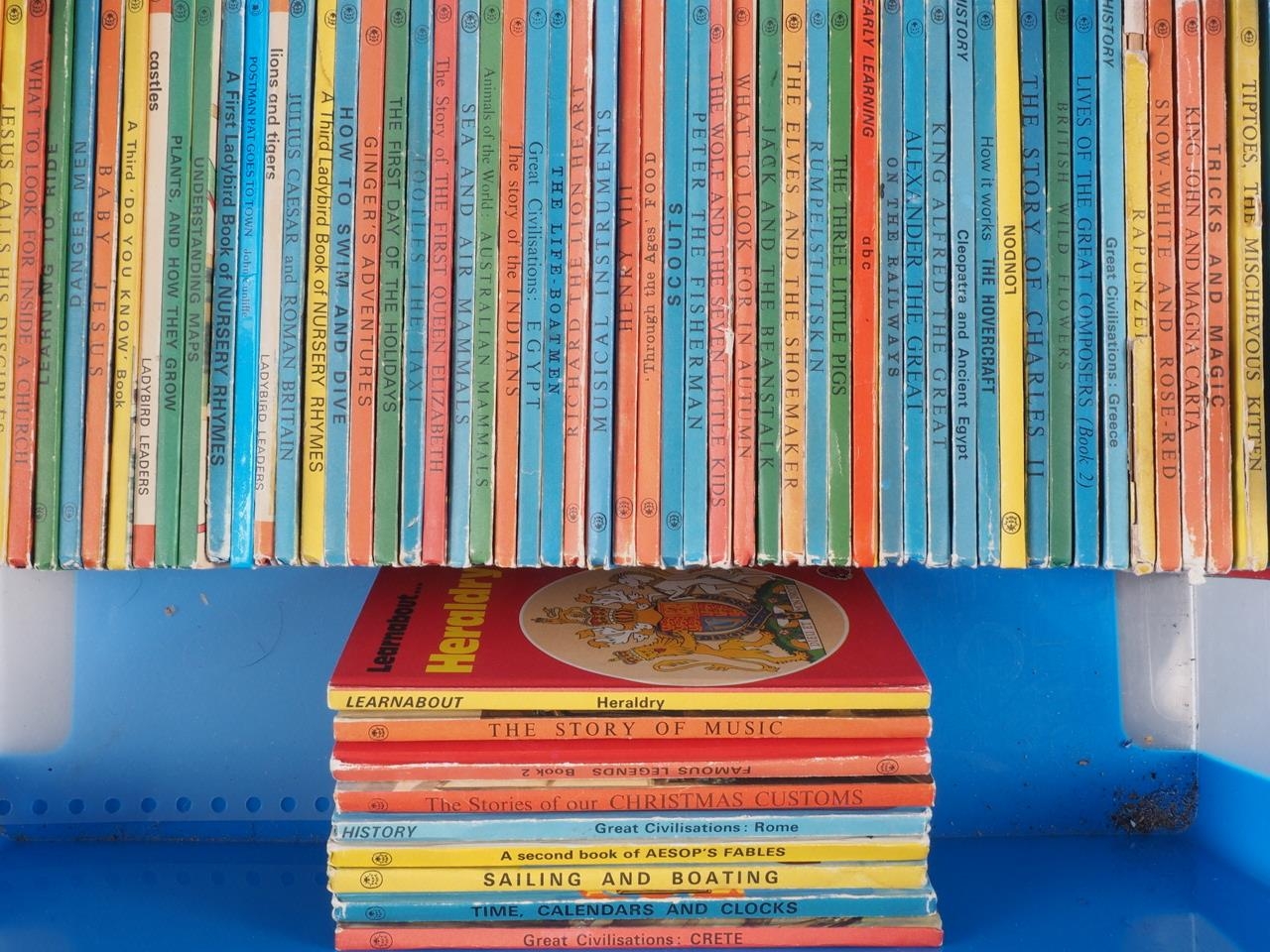 A collection of Ladybird books, including "The Story of Music" and "Tiptoes, The Mischievous