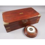 A mahogany and brass mounted writing slope with green leather interior, 19 3/4" wide, and a circular
