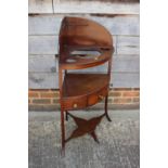 A 19th century mahogany bowfront corner washstand, fitted single drawer, on splayed supports