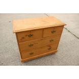 A waxed pine chest of two short and two long drawers with brass handle plates, 34" wide x 17 1/2"