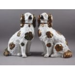 A pair of 19th century copper lustre decorated Staffordshire dogs, 15" high
