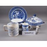 A quantity of blue and white china, including a "Willow" pattern tureen and cover, and various