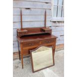 An Edwardian mahogany and inlaid bedroom suite, comprising a wardrobe enclosed mirror door over