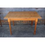 A pine kitchen table, 48" wide x 32" deep x 28" high, and four panel seat chairs