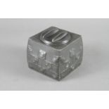 A Tudric pewter square biscuit box and cover, after Archibald Knox, base stamped "9/Tudric/0194",