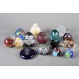 Fifteen assorted glass paperweights