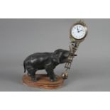 A late 19th century bronze anodised elephant clock with swinging movement (for repair), 11" high