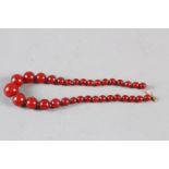 A cherry Bakelite circular graduated bead necklace, 17" long, 49.2g