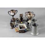 A quantity of silver plated trophies, a silver plated cigarette box and other items