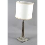 A silver plated table lamp, formed as a column, on stepped base, 17 1/2" high