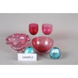 Eight wine glasses with ruby bowls, two similar bowls and a pair of paperweights