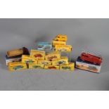 A collection of Dinky and other die-cast vehicles, including 555 fire engine, 522 Big Bedford lorry,