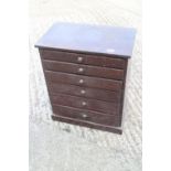 A collector's polished as mahogany chest of six graduated long drawers, 15" wide x 9" deep x 17 1/2"