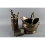 A brass coal scuttle, fire implements and a quantity of assorted decorative brassware