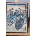 A Japanese woodblock print, on textured paper, figures in a garden in passe-partout mount