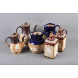 A pair of Doulton sprigged stoneware spirit decanters and stoppers (damages), two similar coffee