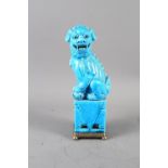 A Chinese blue glazed Dog of Fo, on later brass stand, 12 1/4" high overall