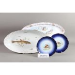 Three Limoges porcelain fish dishes and a set of six Limoges fish decorated plates