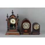 An Ansonia mantel clock, in mahogany lancet case with presentation plaque dated 1927, 13" high, an